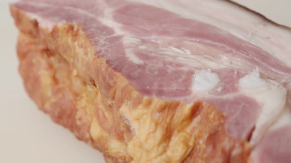 Tilting on pork meat product close-up layers on cutting board  4K 2160p 30fps UltraHD footage - Cure