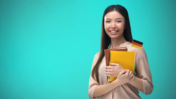 Cheerful Woman Holding German Flag Book, Education Abroad, Learning Language