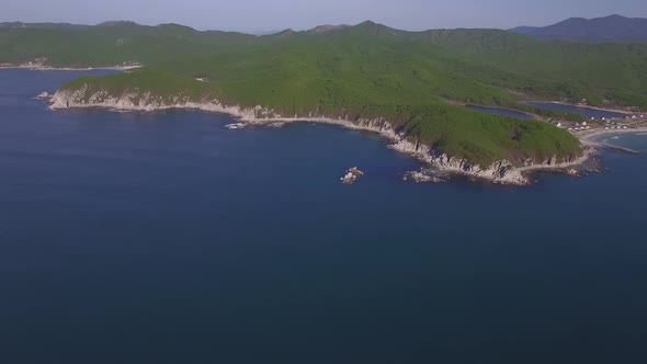 Aerial View of a Beautiful Promontory with Clear Blue Water