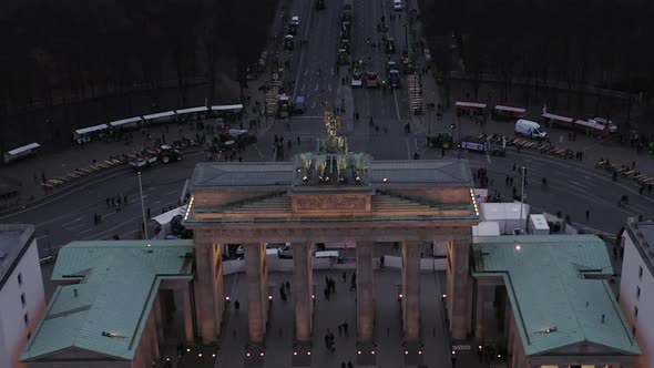 AERIAL: Over Brandenburger Tor with City Traffic Lights in Berlin, Germany 