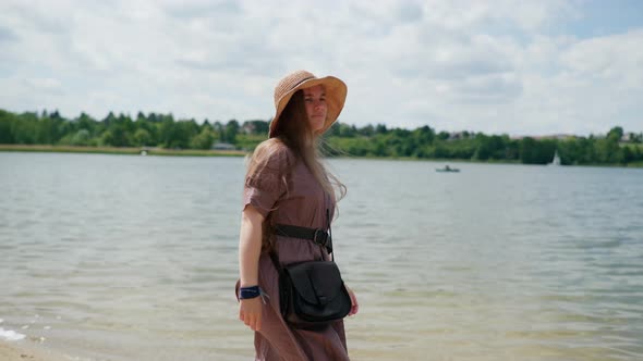 Girl Walking Along the Lake