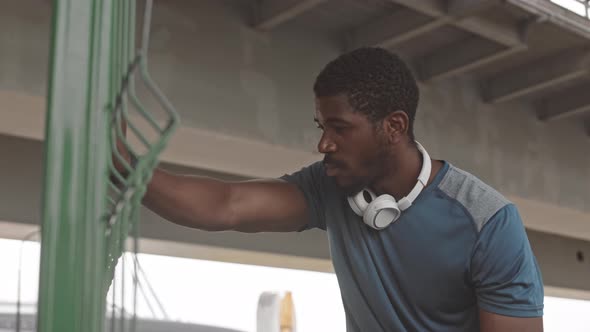 African-American Sportsman Taking Breath after Jogging