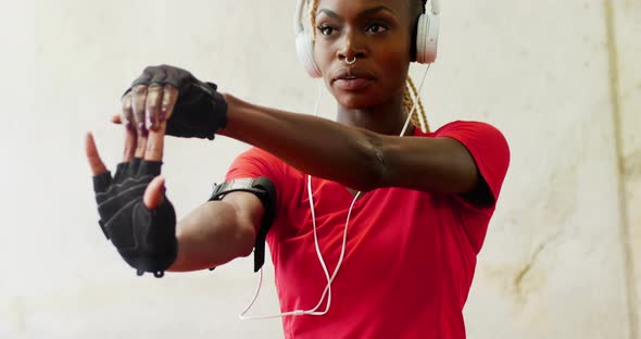 Fit woman exercising with headphones