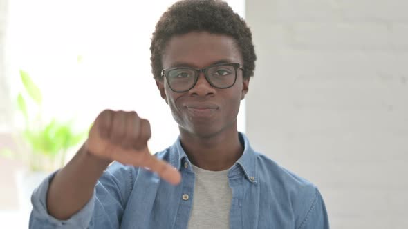 Portrait of Young African Man Showing Thumbs Down