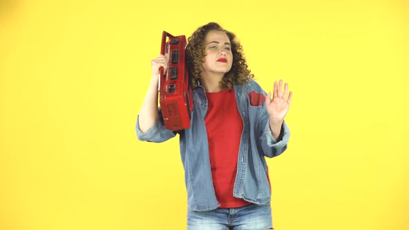 Girl Enjoying the Music and Dancing with the Red Boombox on Her Shoulder, Retro Style