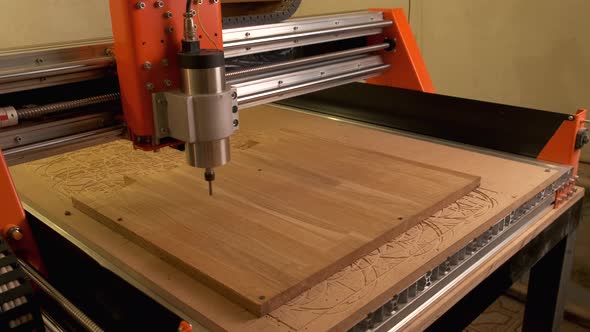 The Wood Cnc Machine Starts Working and Drills a Circle Into the Board Blank