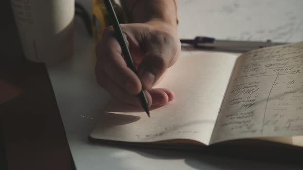 Male Hands Draw with a Pencil. Architect's Desk Blueprint, Pencil