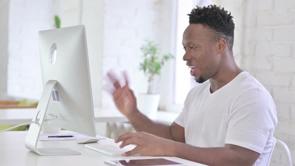 Cheerful Casual African Man Doing Video Chat on Desktop