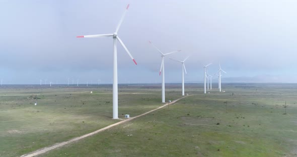 4K aerial wiev of windmills farm. Modern wind turbines.