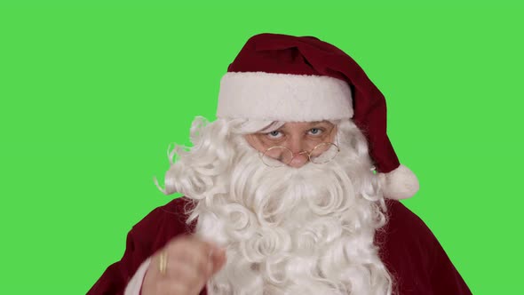 Santa Claus on Green Screen Background Tilting Glasses Knowingly