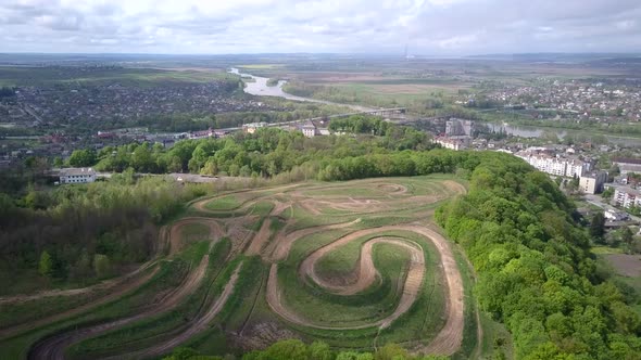 Dirt road tracks in field for motorcycle racing.