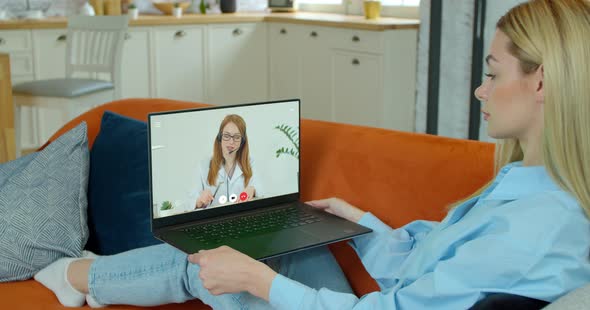 Woman Checks Possible Symptoms with Professional Physician, Using Online Video Chat. Young Girl Sick