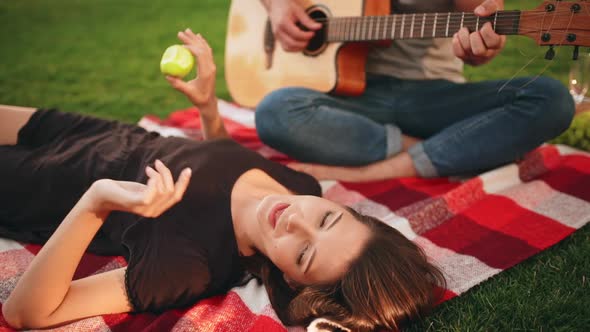 Young Beautiful Couple Smiling Resting in Park