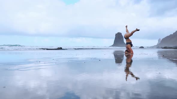 Flexible Yoga Woman Stretching Forward Bend Touching Forehead To Knees Outdoors Sunset Sea Beach