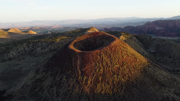 Aerial jib drone view of a dormant volcano in St. George, Utah.  Unique desert landscape. Sunset vie
