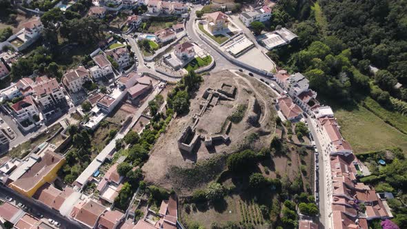 Ruins of medieval castle in the civil parish of Alcobaça, aerial orbiting shot above view.