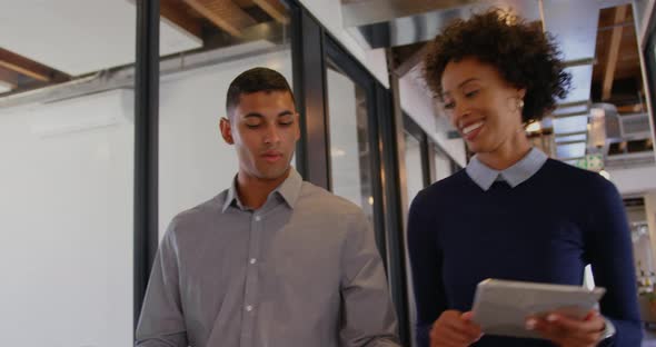 Business people interacting with each other in modern office 4k