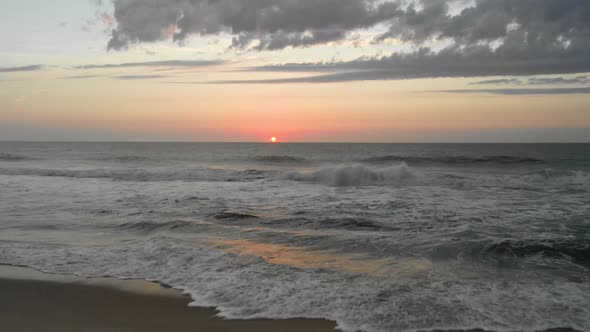 Elevated view of a beach while the sun sets