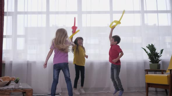 Active Games at Children Party, Little Ones Happy Friends Have Fun Fighting with Balloons, Jumping