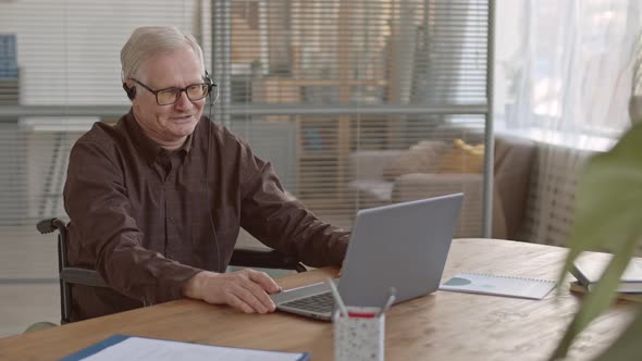 Senior Office Worker Having Video Conference