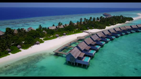 Aerial top view texture of tranquil shore beach holiday by blue ocean and white sand background of a