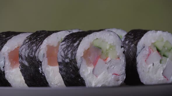 Sushi Roll Turned on a Green Background