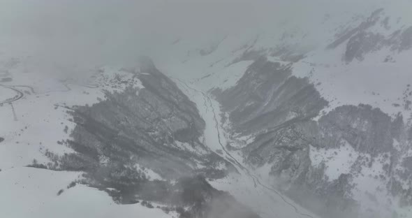 Aerial view of beautiful snowy mountains in Gudauri, Georgia