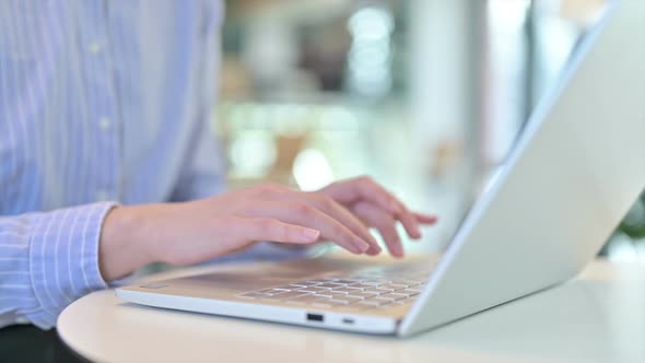 Close Up of Female Hands Typing on Laptop