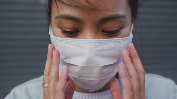 Woman wearing medical coronavirus mask on the street