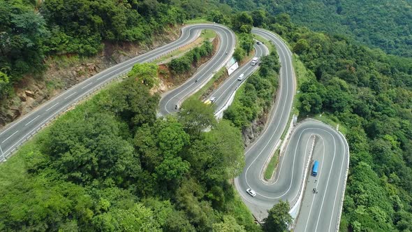 Flyover Vehicles On A Winding Bend Road