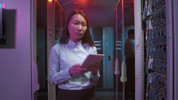 Portrait of Female Technician Posing in Data Center