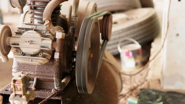 Close-up shot of belt rotation of an air compressor.