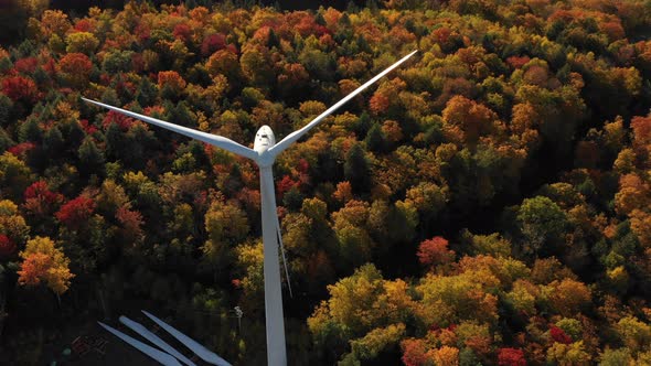 Clean Energy Windmill turbine wind farm aerial during beautiful autumn leaf season