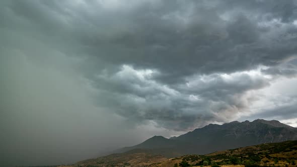 Timelapse of rain pushing storm over Timpanogos Mountain