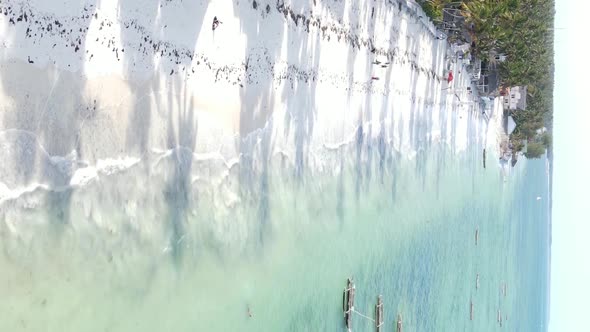 Vertical Video Boats in the Ocean Near the Coast of Zanzibar Tanzania Aerial View