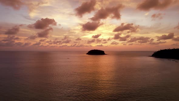 Luxury Yacht at Sunset with a View of the Island