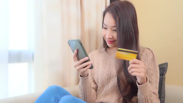 Young asian woman use smart phone