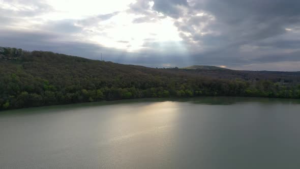 Sunlight Burst on Mountain Lake