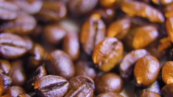 Close Up of Roasted Coffee Beans Spinning Seeds of Coffee