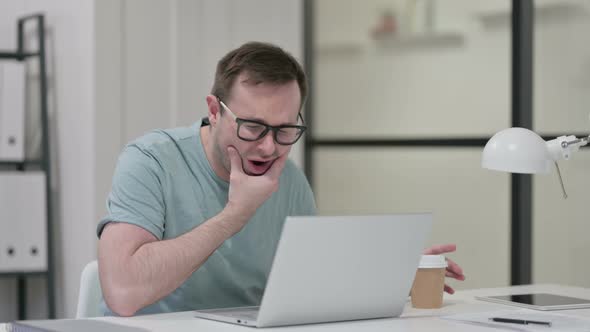 Young Man Having Toothache While Drinking Coffee