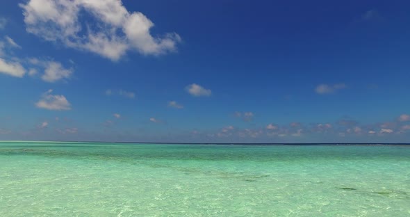 Beautiful fly over abstract view of a sunshine white sandy paradise beach and aqua blue water backgr