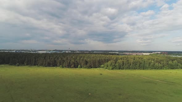 Aerial View of Wheat Fields, Meadow, Forest and Village in Rural Russia