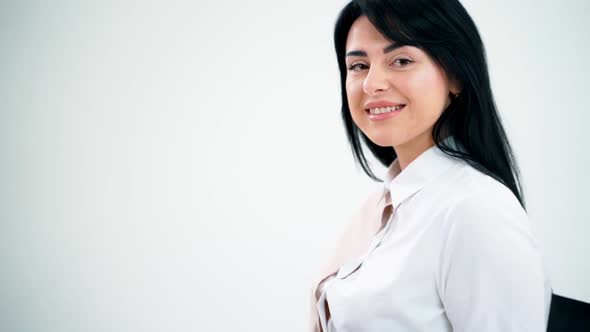 Portrait of beautiful female freelancer working on a laptop