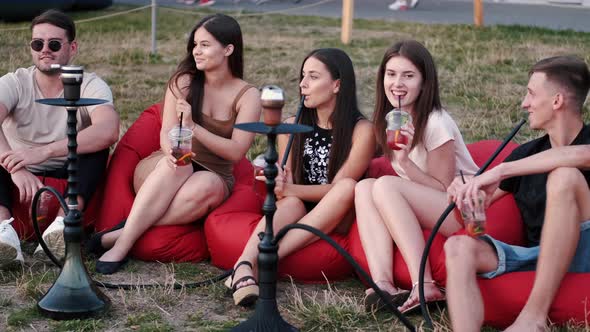 European Friends Are Chilling Out and Smoking Shisha at the Beach