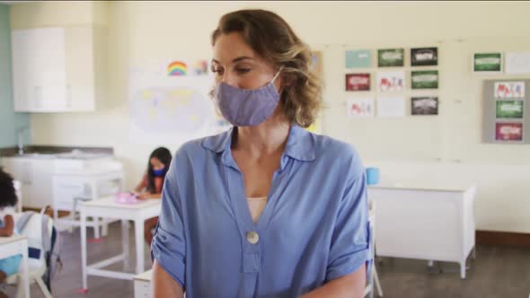 Female teacher wearing face mask at school