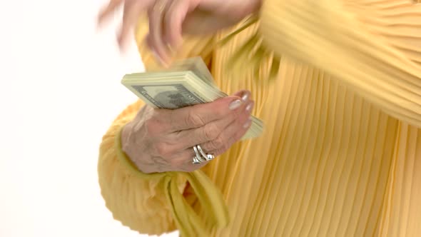 Senior Woman Holding Money Isolated.