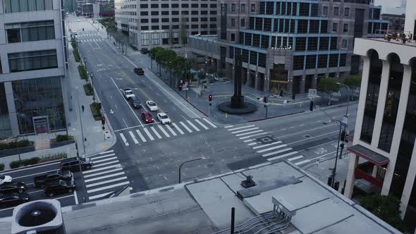 Traffic waits at a traffic light in downtown LA with hardly any cars for an urban metropolis