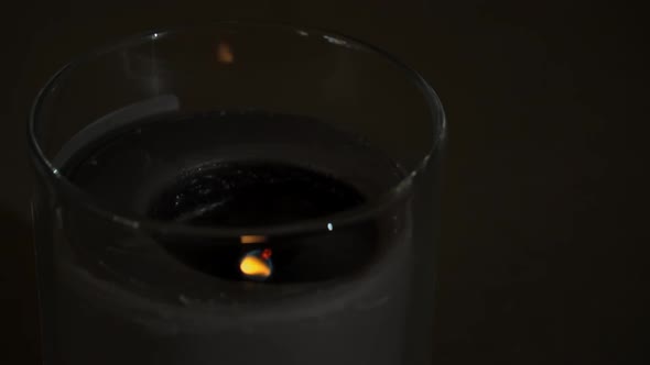Atmospherically a Candle Burns Emitting Its Own Shadow in the Evening