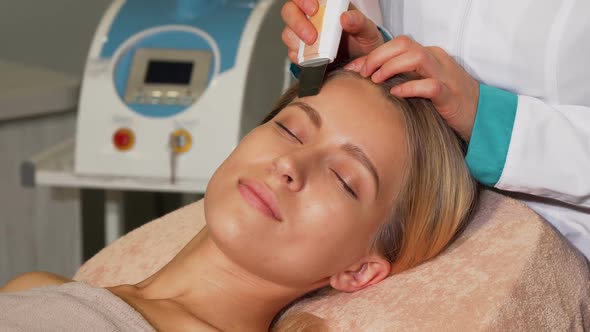 Stunning Woman with Perfect Skin Getting Ultrasonic Facial Treatment