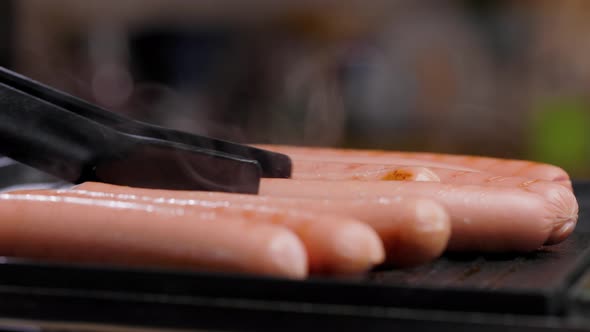 Meat Sausages Are Fried On Grill